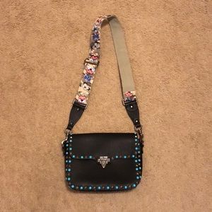 Rock stud inspired cross body bag